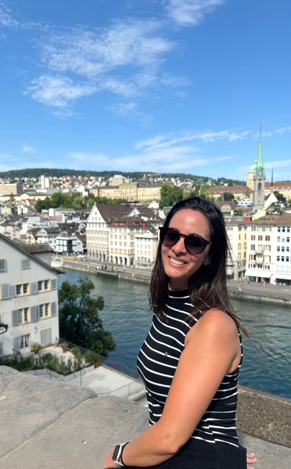 Leticia in Zürich, with the Limmat river and Predigerkirche in the background